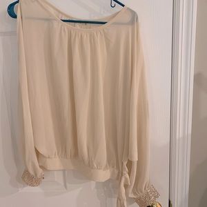 Pretty top with sequin edge on sleeves